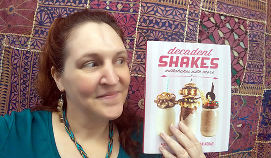 Carma poses with her copy of Decadent Shakes