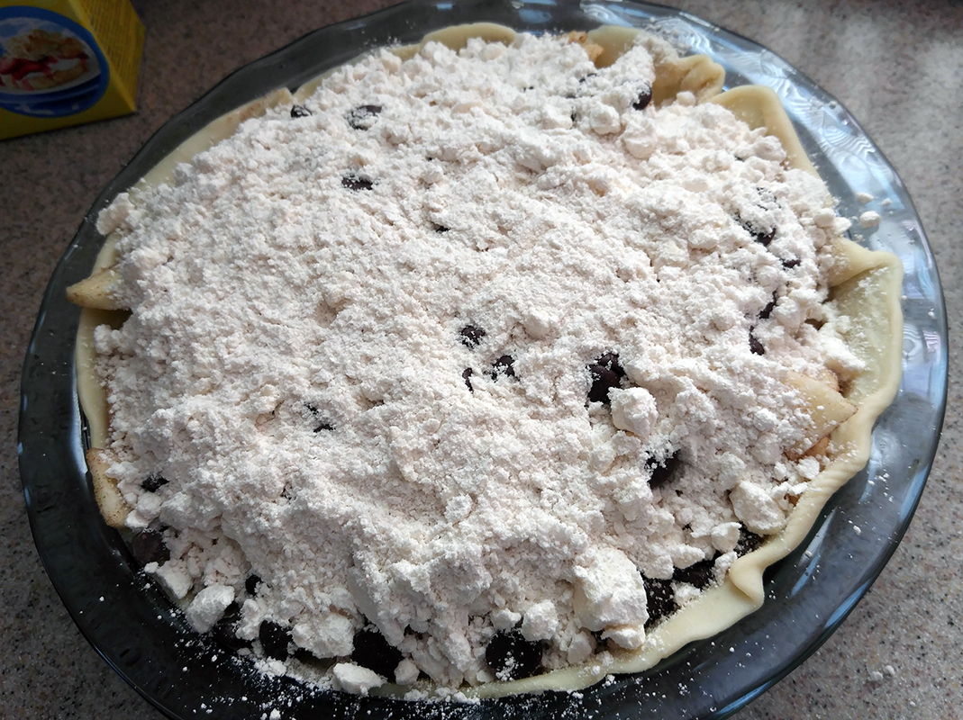 Top pie with crumble mixture.