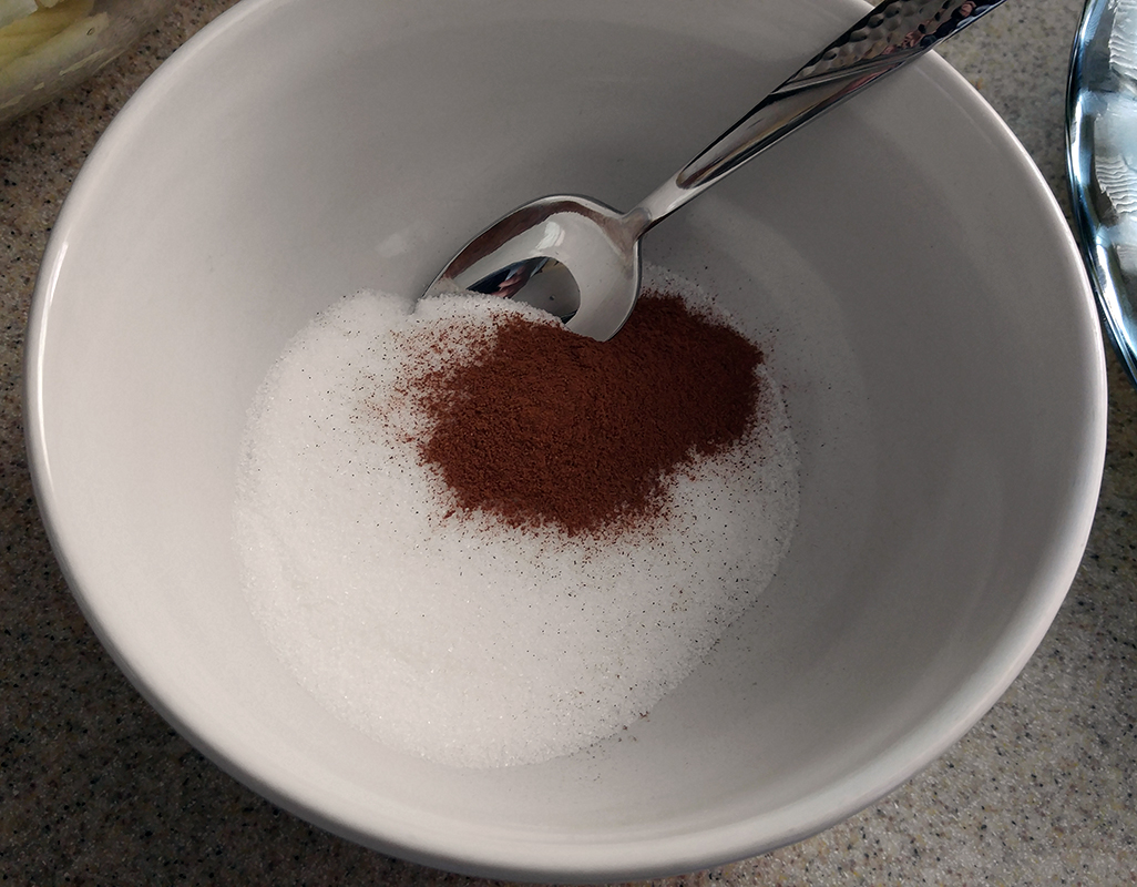 Measure cinnamon and sugar into a small bowl.