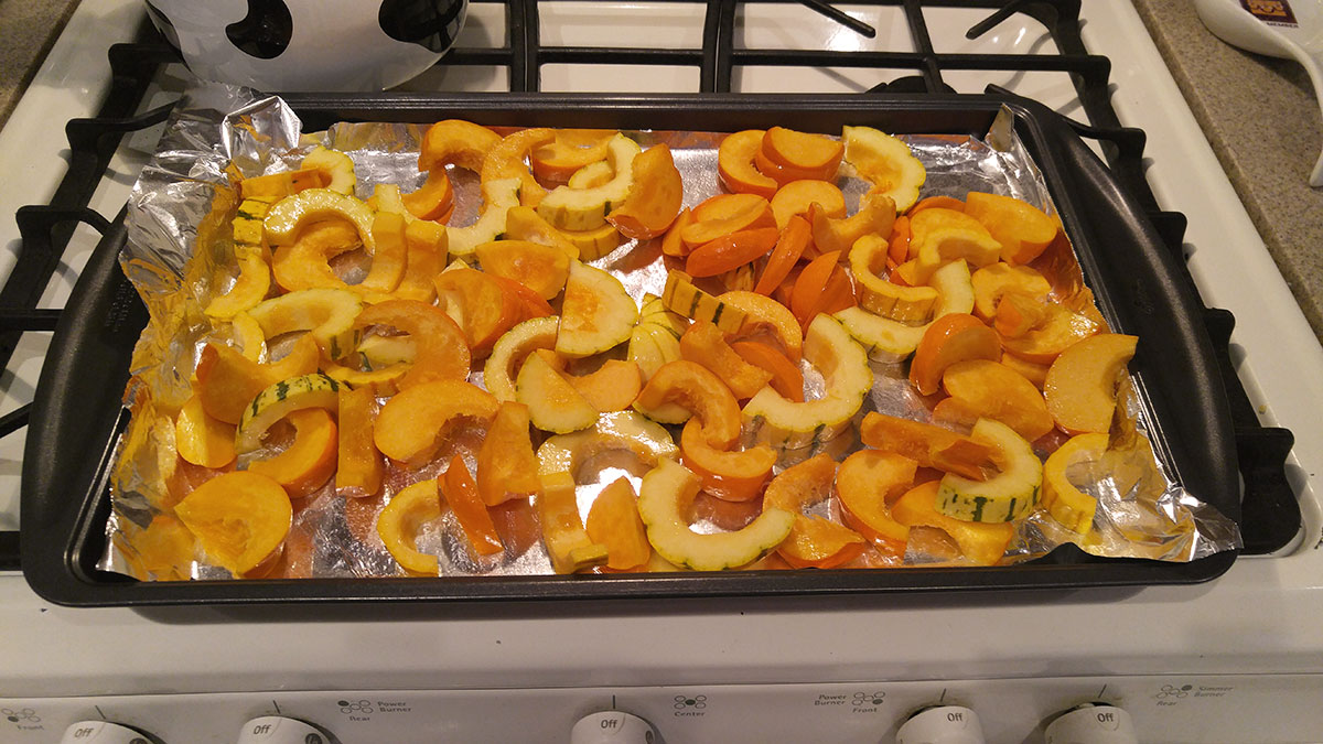 sliced winter squash ready to bake